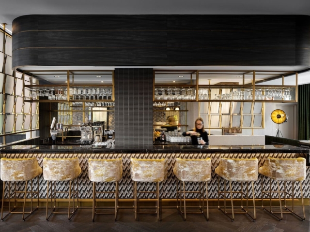 The Dorian bar with patterned stools and brass details